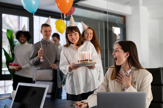 Medium shot happy people surprising colleague