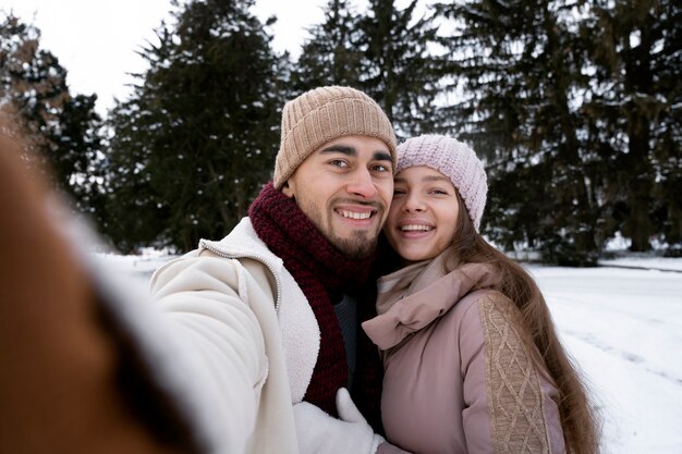 Medium shot happy people taking selfie