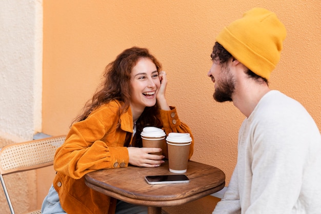 Medium shot happy people with coffee