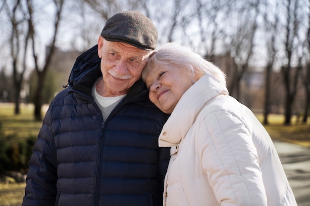 Medium shot happy senior people in park