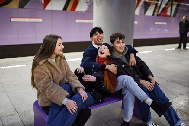 Medium shot happy teens sitting together