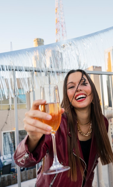 Medium shot happy woman holding drink