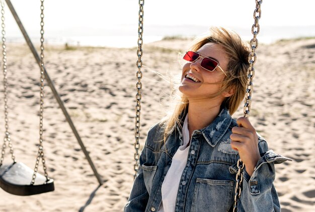 Medium shot happy woman on swing