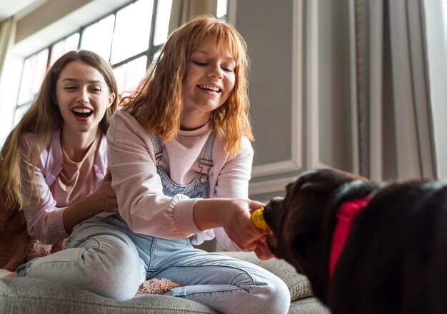 Medium shot happy women with dog