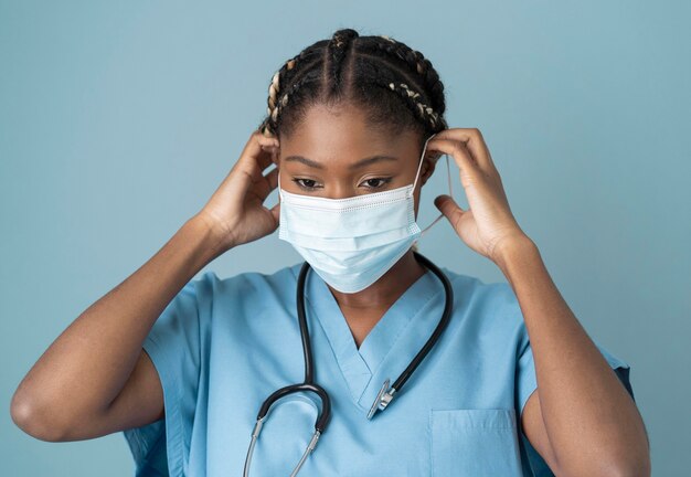 Medium shot health worker wearing mask