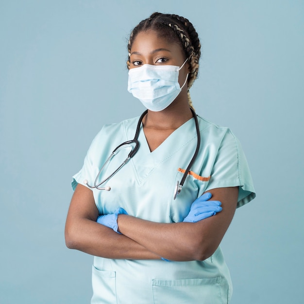 Medium shot health worker wearing mask