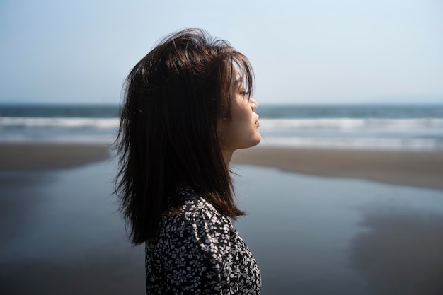 Medium shot japanese woman at seaside