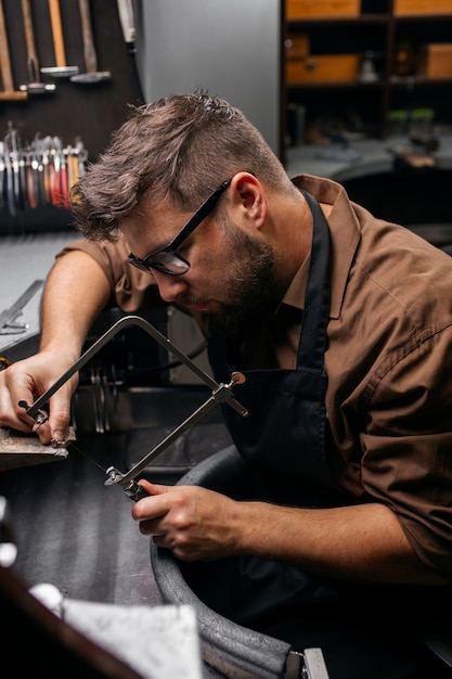 Medium shot jeweler making jewellery