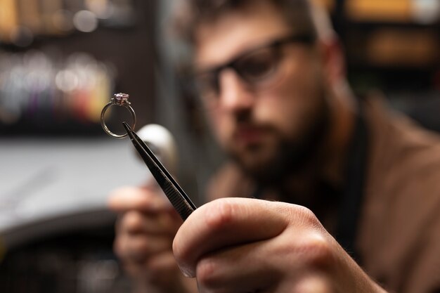 Medium shot jeweler making jewellery