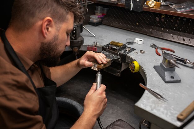 Medium shot jeweler making jewellery