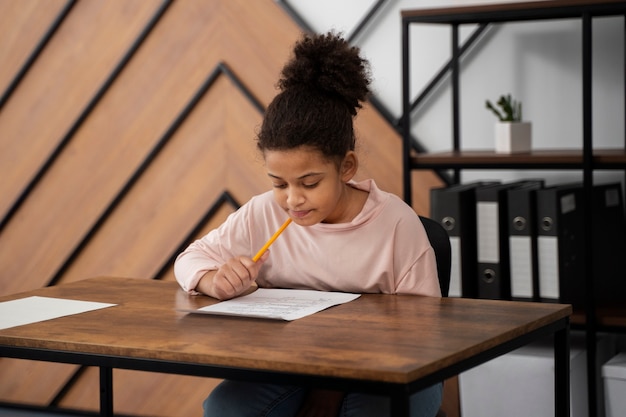 Medium shot kid cheating at school test