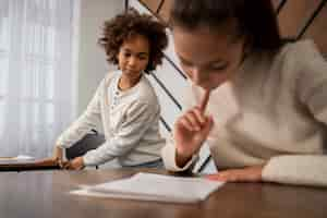 Free photo medium shot kid cheating at school test