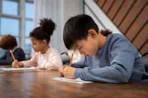 Free photo medium shot kid cheating at school test