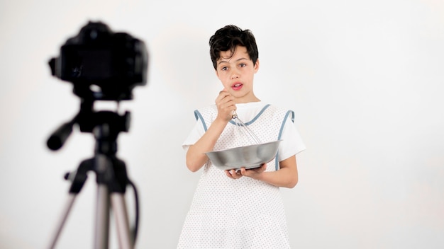 Medium shot kid cooking