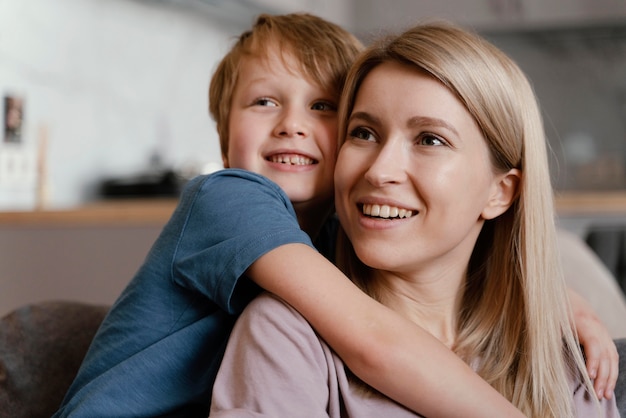 Medium shot kid holding woman