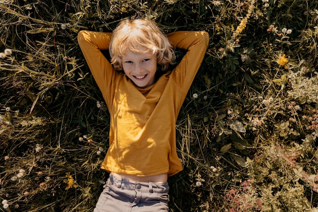 Medium shot kid laying on grass