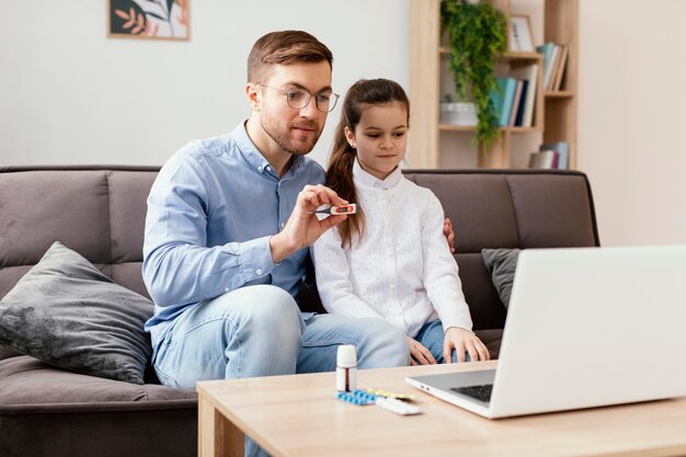 Medium shot kid and man consulting doctor