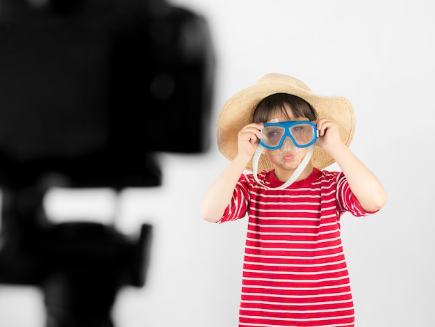 Free photo medium shot kid recording himself