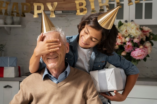 Medium shot kid surprising old man