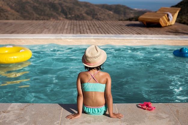 Free photo medium shot kid wearing hat