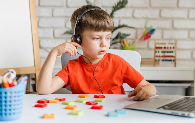 Medium shot kid wearing headphones