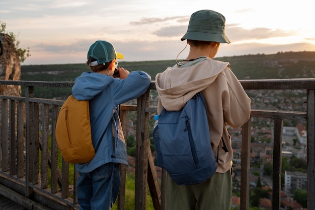 Free photo medium shot kids exploring natural environment