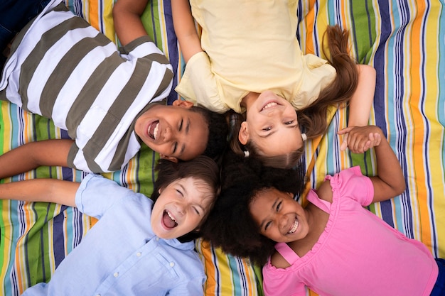 medium shot kids laying together