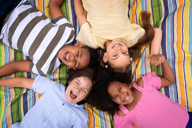 Medium shot kids laying together