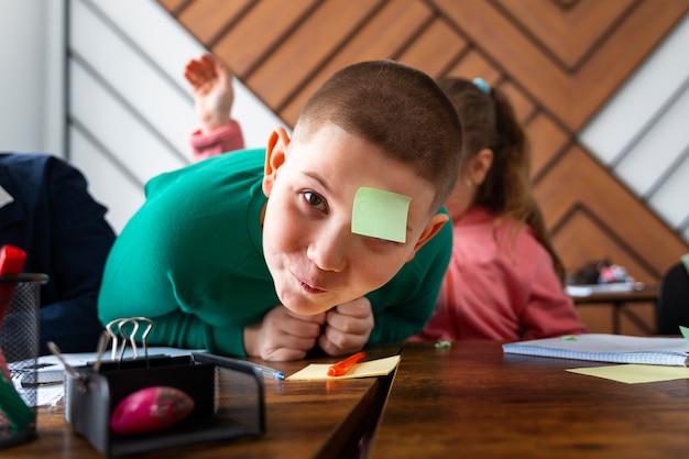 Free photo medium shot kids learning at school