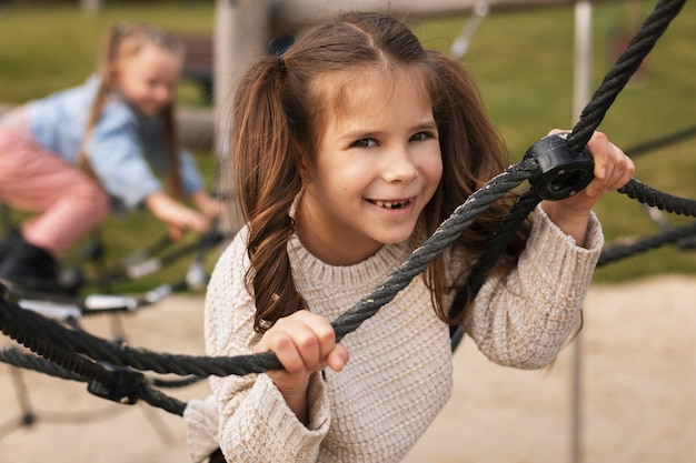 Medium shot kids playing outdoors