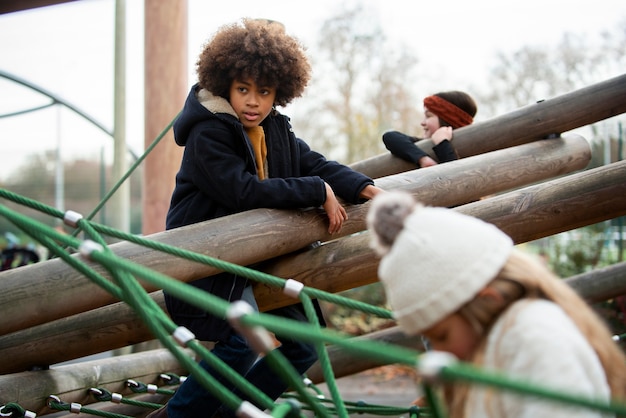 Medium shot kids playing outside