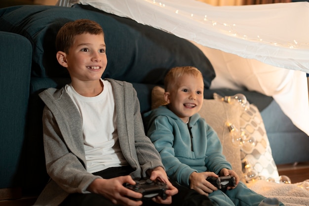 medium shot kids playing video games