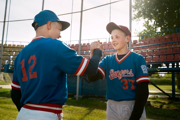 Medium shot kids shaking hands