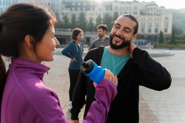 Medium shot latin people training outdoors