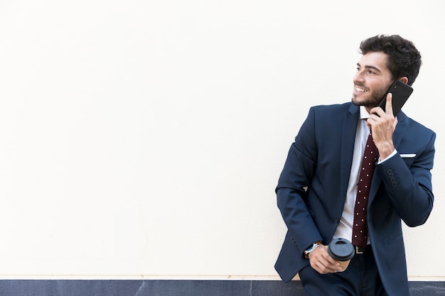 Medium shot lawyer with coffee and smartphone