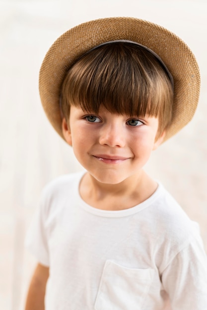 Medium shot little boy wearing hat