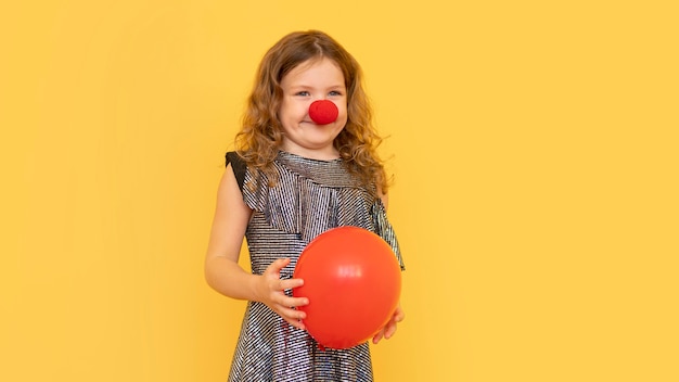 Medium shot little girl wearing clown nose