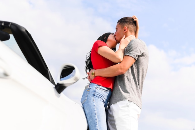 Medium shot of lovely couple kissing