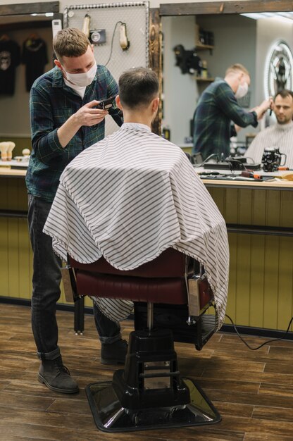 Medium shot of man at barber shop