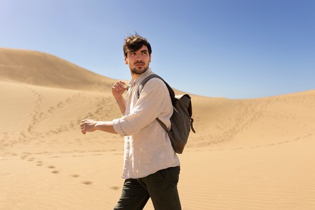 Medium shot man carrying backpack