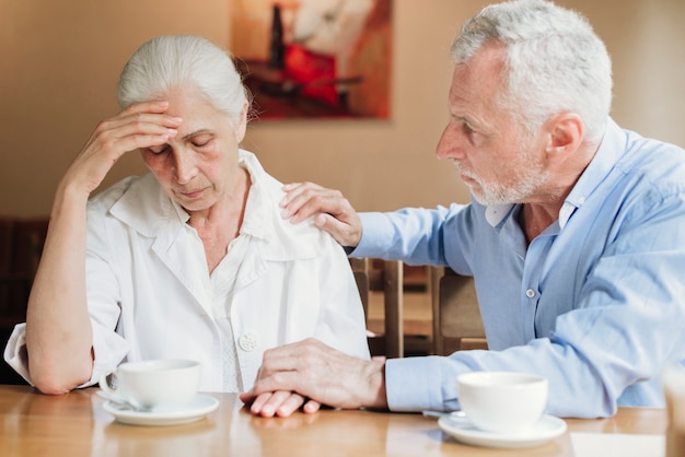 Free photo medium shot man comforting his wife