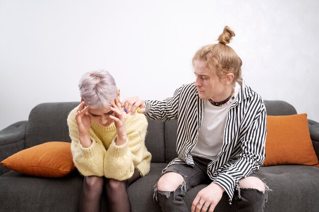 Medium shot man comforting woman