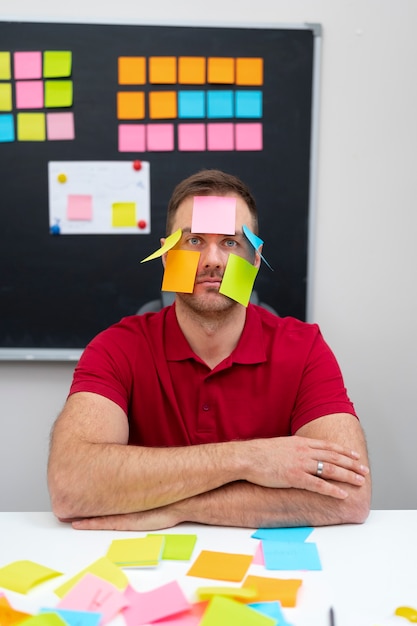 medium shot man covered in post its