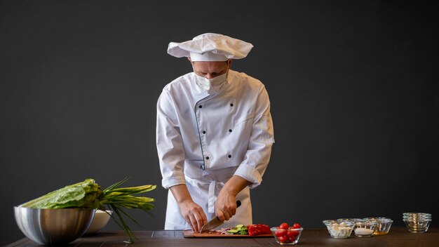 Medium shot man cutting food