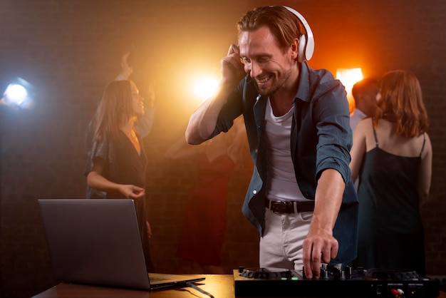 medium shot man dj at club