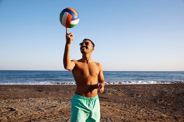 Medium shot man doing tricks with ball