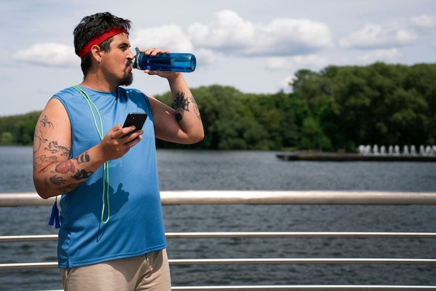 Medium shot man exercising outdoors