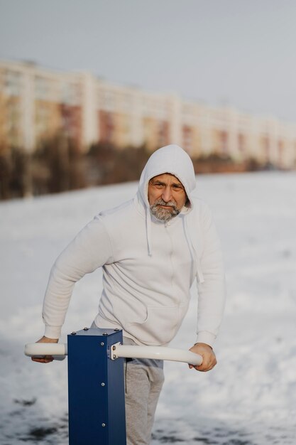 Medium shot man exercising outside