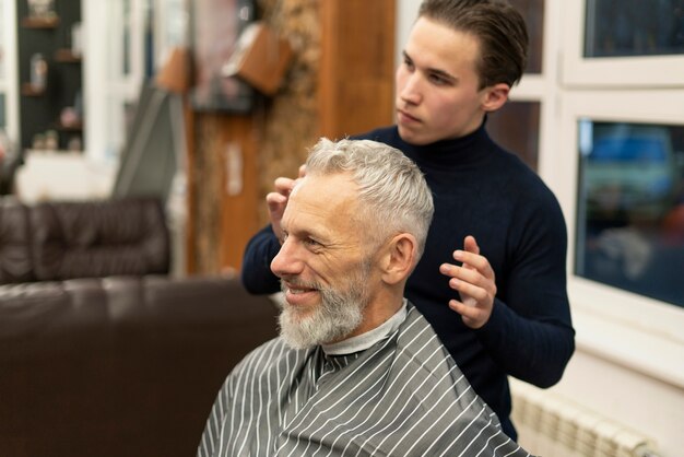 Medium shot man at hairdresser shop