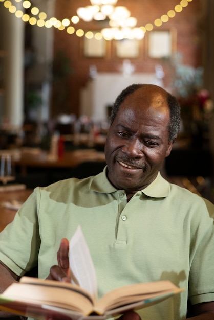 Medium shot man having lunch at restaurant